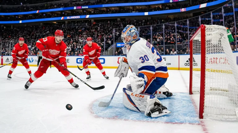 Guarda-redes de hóquei no gelo da NHL em posição defensiva na baliza durante um jogo